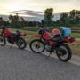 Old enduro motorcycles at sunset after a long ride.